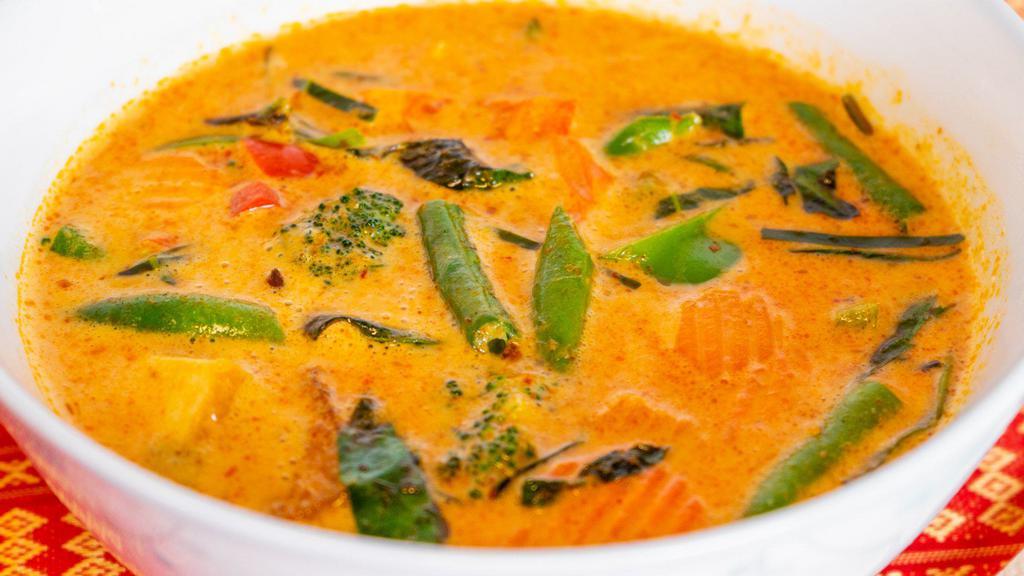 Vegan Panang Curry · Panang curry is rich and creamy, spicy yet balanced. Made with bell peppers, basil, green beans, broccoli, and carrots. Served with Jasmine rice.