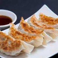 Gyoza · Pan seared pork and vegetable dumplings served with house gyoza sauce