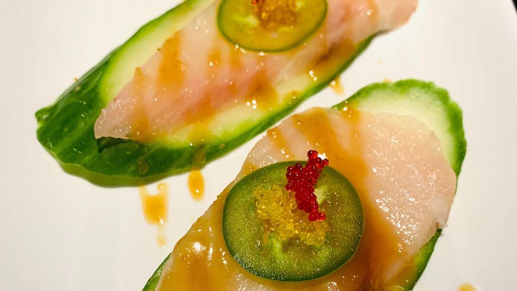 Hamachi Jalapeno · Fresh hamachi sashimi and thinly sliced jalapeno pepper, tossed with yuzu-miso sauce. spicy