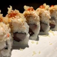 Dynamite · spicy. Tuna and yellowtail roll topped with crab, eel sauce, chili sauce, and tempura crunch...