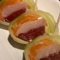 Geisha · Tuna, salmon, yellowtail, lemon, avocado rolled in cucumber and ponzu sauce