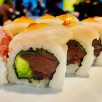 Daniel Roll · Tuna rolled with cilantro and avocado on the inside topped with hamachi, yuzu miso sauce and...
