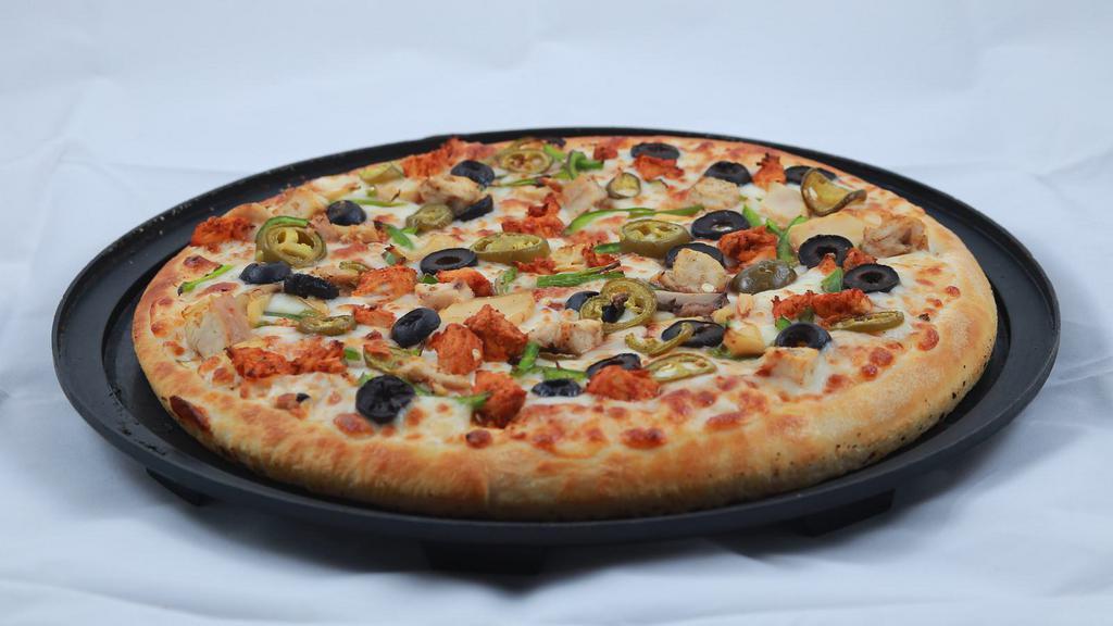 Beef Tikka Pizza · Freshly baked cheese pizza topped with diced beef.