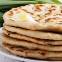 Cheese Naan · Fresh Naan stuffed with homemade cheese and baked to perfection.