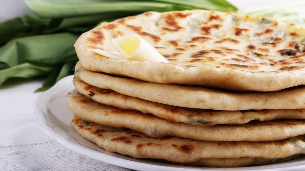 Cheese Naan · Fresh Naan stuffed with homemade cheese and baked to perfection.