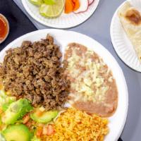 Carne Asada · Grilled steak. Rice and beans salad tortillas