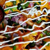 Handlebar Nachos · Yellow corn tortilla chips, melted cheddar jack cheese, jalapenos, black olives and green on...