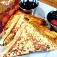 Brioche French Toast · Thick Brioche Texas Toast dredged in a spiced egg custard, cooked to golden brown and topped...