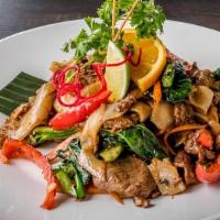 Drunken Noodles · Wide large rice noodles stir-fried with fresh chilies, green peppercorn, fresh Thai basil, s...