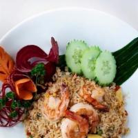 Basil Fried Rice · Jasmine fried rice made with fresh Thai basil, eggs, scallions, carrots, tomatoes, garlic, o...