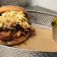 Pulled Pork · Thai chili & pineapple glazed house hickory smoked pulled pork & spicy slaw on a griddled ho...