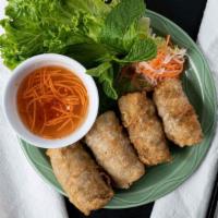 Crispy Rolls (4) / Cha Gio · Crispy rolls with ground pork, shrimp, glass noodles, ear mushroom and a side of nước  mam.