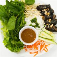 Betel Leaf Beef / Bo La Lót · Minced beef and pork wrapped with betel leaves and grilled. Served with rice paper and a pla...