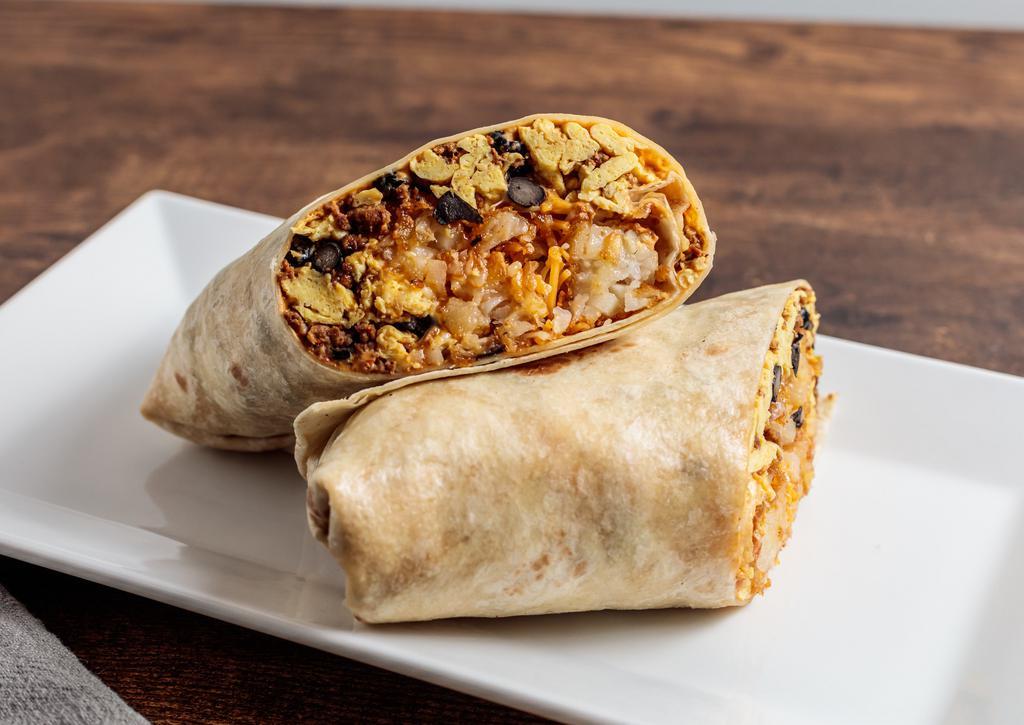 Kick Starter · Eggs, chipotle cream cheese, chorizo, black beans, crispy tater tots and melted shredded cheese rolled in a flour tortilla wrap.  Serve with hot sauce.