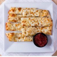 Cheesesticks · Fresh dough brushed with garlic and olive oil and topped with Mozzarella cheese.
