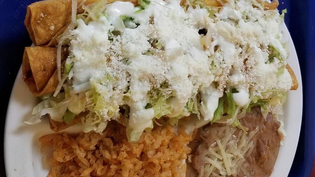 Flautas (3) Only Chiken · Chicken, lettuce, choice of meat, monterey jack cheese, sour cream and tomato sauce.  Rice and beans on the side