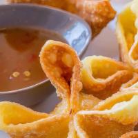 Crab Cheese Wonton · Deep fried wonton wrapped with cream cheese a crab meat served with sweet & sour sauce.