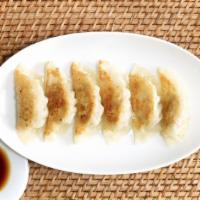 Fried Dumpling · Deep fried pork and mixed vegetable then wrapped in pot sticker skin served with house speci...