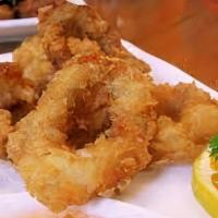 Thai Calamari · Deep fried calamari marinated with special herbs served with sweet & sour sauce.