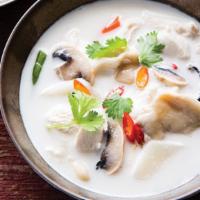 Tom Kha · Hot and sour coconut soup with chicken, tomato, onion, galangal, lime leaves, lemongrass, an...