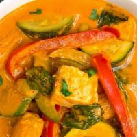 Red Curry · Red curry paste in coconut milk with bamboo shoots, bell peppers, zucchini, and Thai basil.