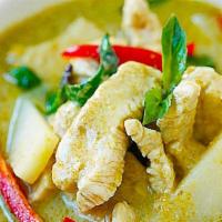 Green Curry · Green curry paste in coconut milk with bamboo shoots, bell peppers, zucchini, and Thai basil.