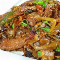 Pad Kee Mow (Drunken Noodles) · Flat wide rice noodles stir fried with baby corn, green bean, broccoli, zuchini, mushroom, g...