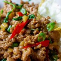 Pad Ka Pow (With Fried Egg) · Ground chicken or pork stir fried with holy basil, onion, and bell pepper.