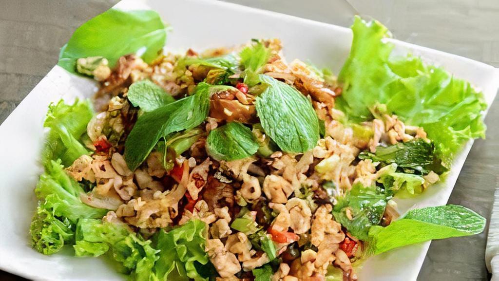 Larb · Ground meat with rice powder, spices, herbs, lime juice, and chili.
