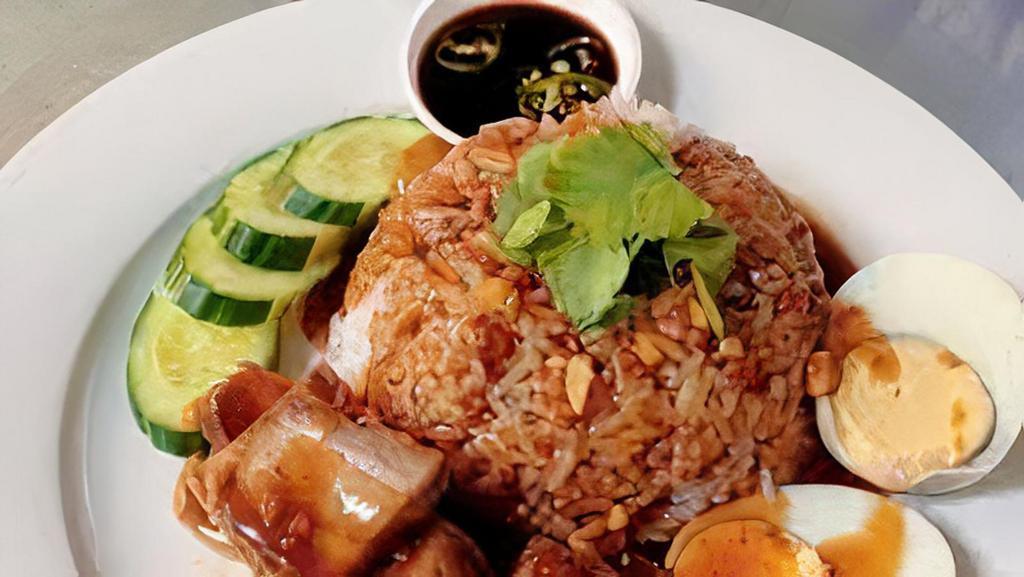 Khao Moo Krob · Crispy pork over rice, boiled egg, and gravy.
