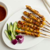 Satay · Marinated beef or chicken on skewers, charcoal grilled to perfection. Served with peanut sau...