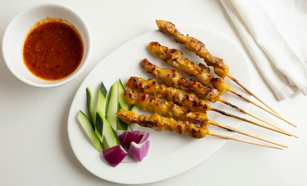 Satay · Marinated beef or chicken on skewers, charcoal grilled to perfection. Served with peanut sauce.