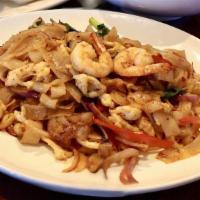 Basil Noodles · Stir fried flat rice noodles shrimp, chicken, onion, vegetables, chili and basil leaves.