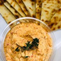 Pita And Roasted Red Pepper Dip - D · A warm pita served with our house made roasted red pepper and feta cheese spread.