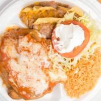Chiles Rellenos · Two pasilla chiles stuffed with Monterey jack cheese and deep fried. Topped with ranchera sa...