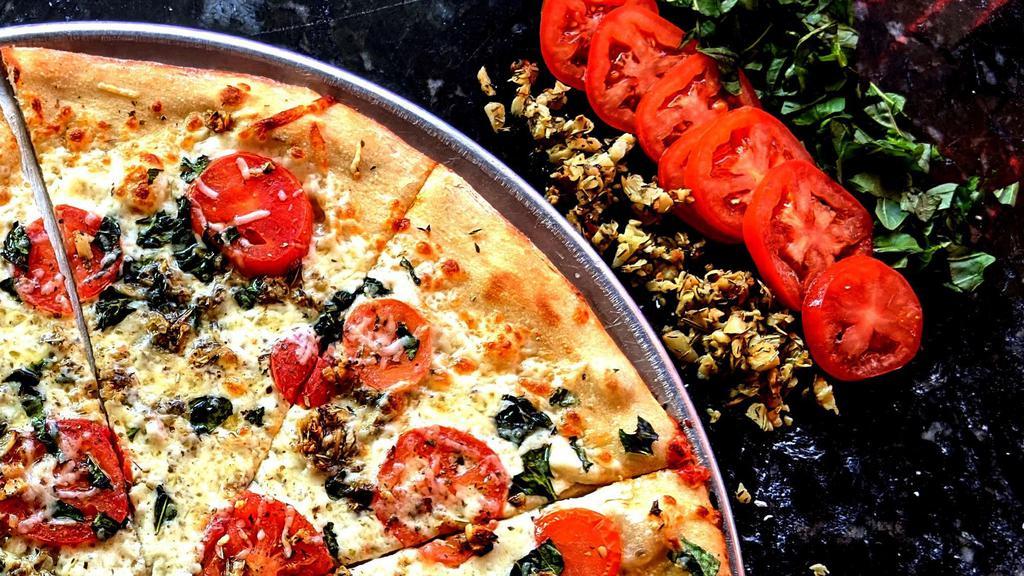 Margheritah Eat-A-Pizza · Olive oil, fresh tomatoes, roasted garlic, fresh basil and topped with oregano