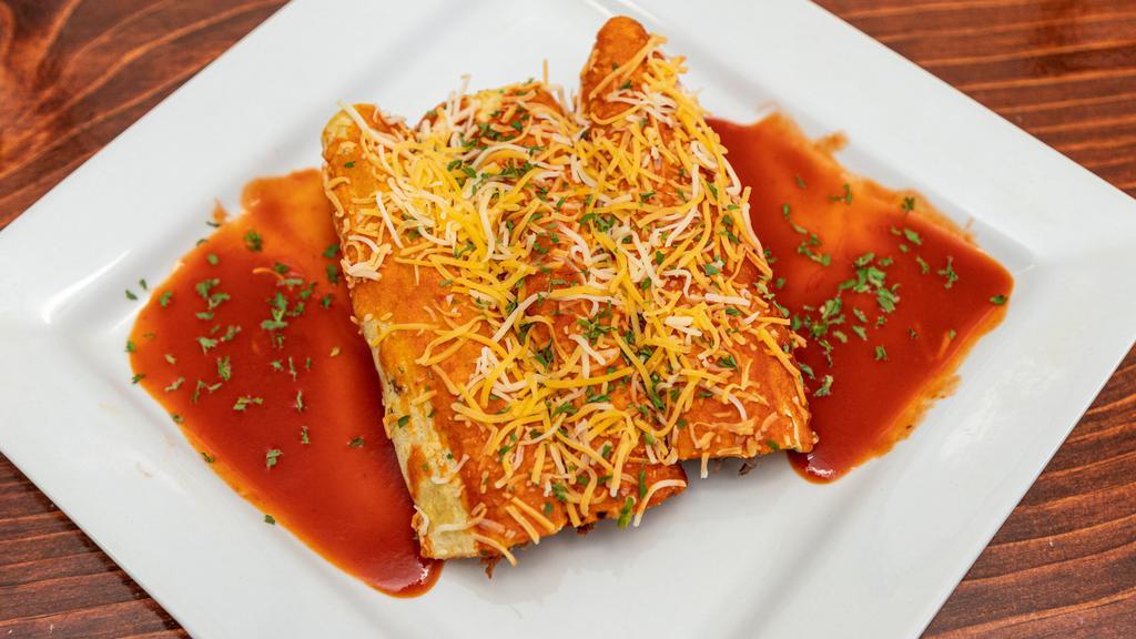 Red Enchilada  · 3 Rolled Shredded Steak Enchiladas Topped with Mexican Style Cheese with Red Chili