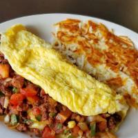 Mexican Omelet
 · Chorizo, jalapeños, onions, tomatoes, avocado and cheese. Served with your choice of hash br...