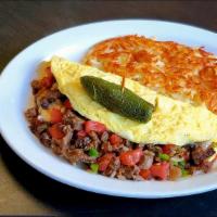 Carne Asada Omelet
 · Chopped steak, tomatoes, onion, jalapeño and cheddar cheese folded into fresh cooked eggs, s...