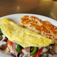 Philly Steak Omelet
 · Roasted beef, mushrooms, green and red bell peppers, onions salted and swiss cheese, served ...