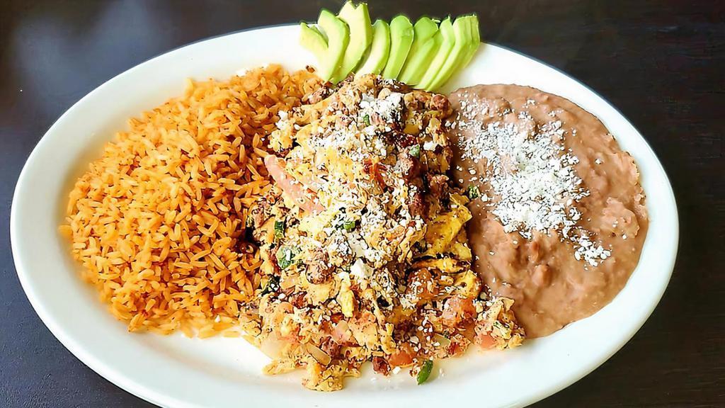 Chorizo Scramble
 · Chorizo cooked with fresh scrambled eggs, cheese, onions, tomatoes and jalapeños, served with rice refried beans and choice flour or corn tortillas.