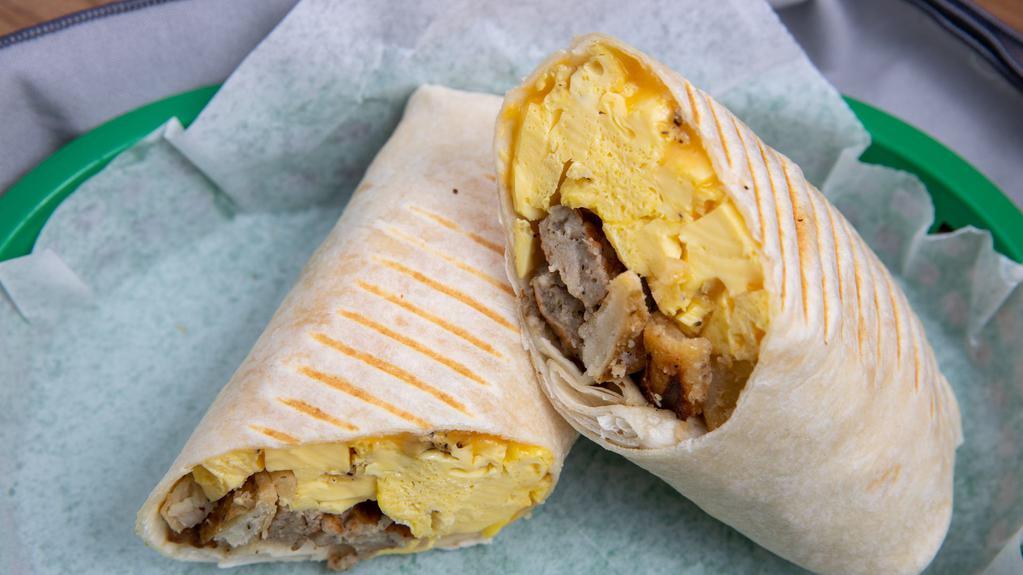 Burrito Breakfast · Scrambled eggs with bacon, choice of meat, seasoned diced potatoes and Colby Jack cheese wrapped in 12 inches tortilla with a side of salsa.