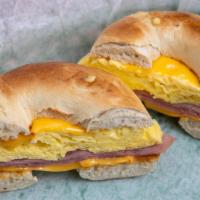 Bagel Breakfast · Scrambled eggs, American or cream cheese and bacon. Choice of meat.