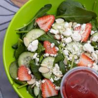 Spinach Strawberry Salad Meal · Spinach, strawberries, cucumber feta crumbles and almonds with raspberry vinaigrette.