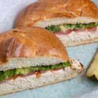 Tuna Sub Sandwich · Tuna salad lettuce and tomato on a lightly toasted kaiser roll.
