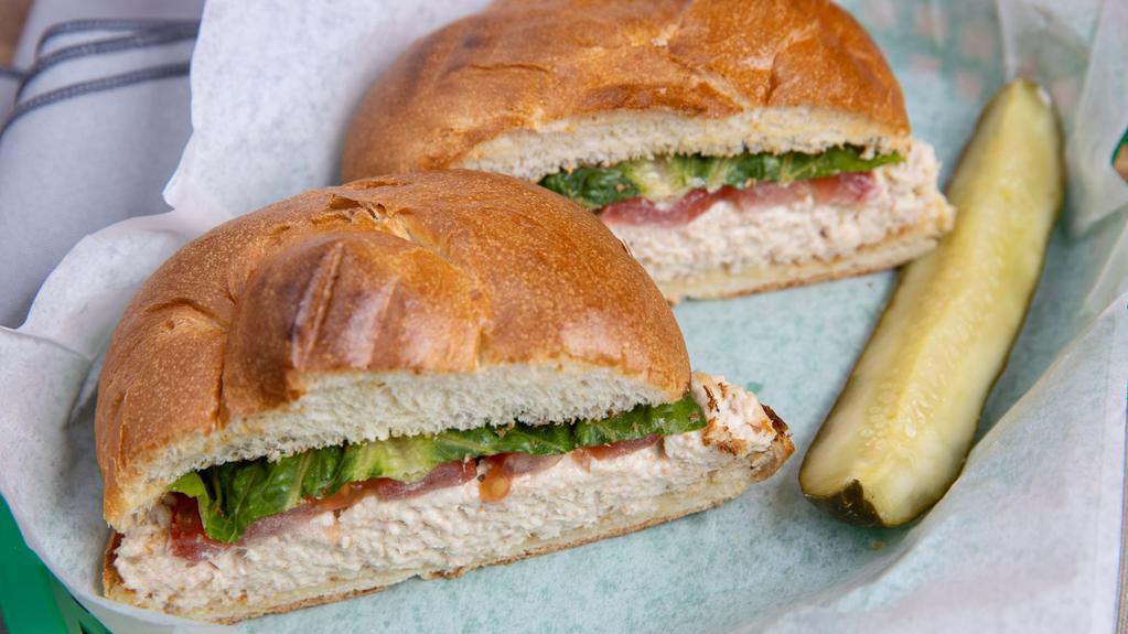 Tuna Sub Sandwich · Tuna salad lettuce and tomato on a lightly toasted kaiser roll.