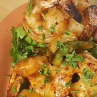 Grilled Shrimp (6) · Jumbo shrimp marinated with Cajun seasoning, saffron, olive oil, and lemon juice.