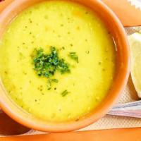 Lentil Soup · Red lentils simmered with diced carrots, onions, cumin, and parsley.