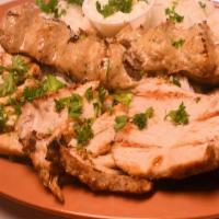 Chicken Barg · Two chicken breasts marinated in lemon juice, olive oil, garlic, saffron and spices. Grilled...