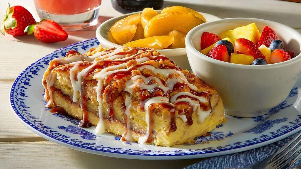 Cinnamon Pancake Casserole Breakfast · Our signature pancakes layered with cinnamon filling, and topped with streusel, cream cheese icing and cinnamon syrup. Served with fresh fruit and a breakfast side.